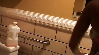 Big booty beauty in pink fishnets urinates in restroom