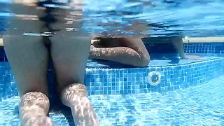 Three horny lesbian girls with big tits have fun playing with their dildo in the swimming pool