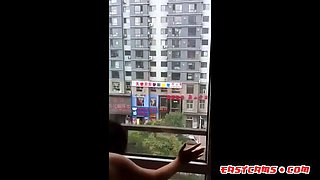 Asian Girl Shared at Open Window