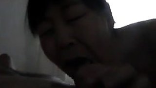 Chinese Woman Giving Head To A Big DIck