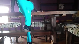 MILF with Beautiful Legs in Pantyhose and Heels Lying on the Table
