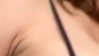 Sexy brunette masturbating with her dildo toy in close up