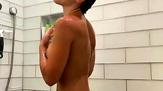 Brunette with glasses masturbates hairy pussy