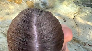 Buxom whore gives stranger blowjob and handjob on the beach
