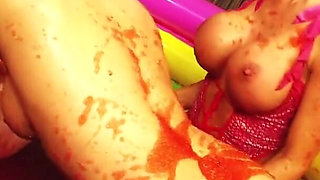Three gorgeous honeys get playful in a pool of jello