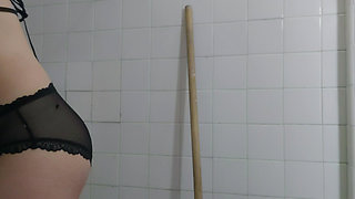 Step cleaning the bathroom on lingerie