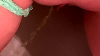 Piss on Her Pussy Lips While Shes Also Peeing on the Toilet