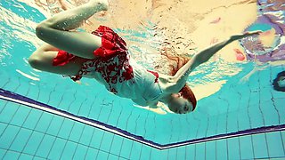 Hot Polish redhead swimming in the pool
