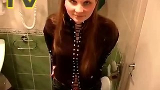 Titless cute redhead teen Galina sits on toilet bowl and pisses