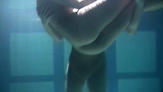 Two delicious and naked sluts make out while diving