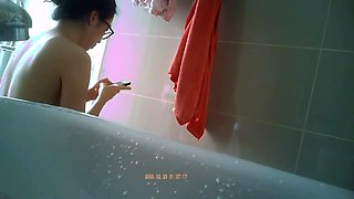 Innocent asian spy in a bathroom