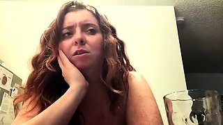 Amateur redhead Jacqueline with glasses masturbates