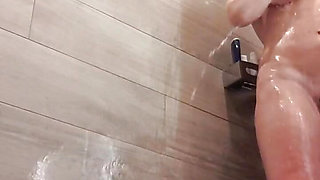 Milf Julie squirts in shower at campsite