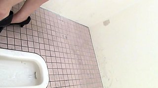 Asian pisses in toilet