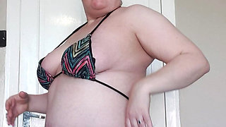 Stripping in my bikini showing off my ass