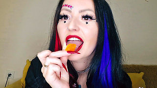 Food fetish. Dominatrix chews gummies. Teeth fetish, chewing fetish
