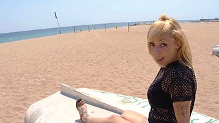 The sexy blonde Perla Rubia on the beach in a fishnet outfit