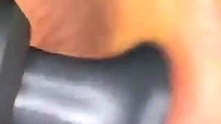 Ebony Girl Gives Her Feet a Massage with a Massage Gun