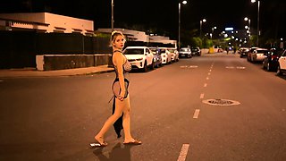Beautiful blonde shows her naked body on the street at