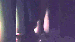 Naughty Brunette in the Dark Room Doing Stripetese