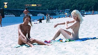 Beautiful blonde nudist sunbathe her trimmed pussy
