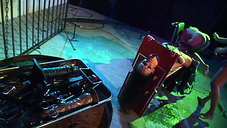 Slutty Brunette in a Cage Gets Fucked in a Double Penetration