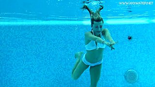 Hot American blonde Lindsay Cruz swims naked in the pool