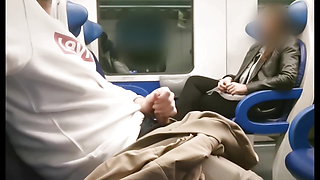 STRANGER looks at my cock and jerks me off in the train