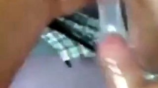 Two Guys Cum Together in a Condom