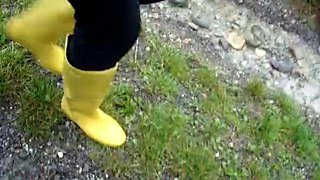 In long Zivalco Rubberboots and barefoot on Street and River