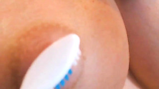 Teasing Big Milky Tities with Toothbrushes