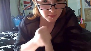 Young in glasses with a transparent t-shirt sucks her boyfriend
