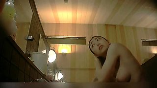Voyeur spying on beautiful Japanese girls taking a shower
