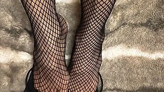 Fishnet in Open Toe Shoes with Red Nail Polish