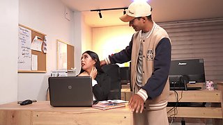 A slutty secretary has the job of pleasing her boss' son's cock