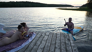 Two Girls Took Their Clothes off on the Lake. a Passing Surfer Had Sex in the Open Air