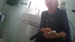 Milfs spied while visiting the bathroom