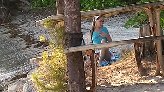 Ashlyn Lee goes fishing, but she would rather enjoy a masturbation session on the sand. She gets caught on-camera by our voyeur videographer.