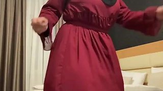 Fatima dancing in hotel room