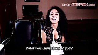 Helena Danae answers casting questions in a leather chair before stripping for the camera