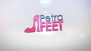 Leather Petra plays with her feet and smokes