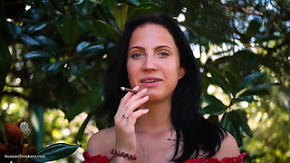 Sultry Brunette in Red Dress Smoking Rolled Cigarette