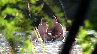Voyeur captures amateur couple having sex on the beach