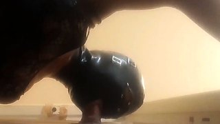 High-Heeled Milf Sucks and Fucks in a Catsuit at a Gloryhole
