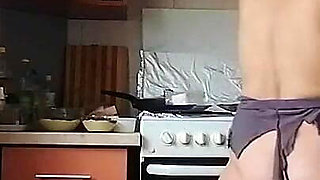 A Sexy Naked Woman Prepares Food in the Kitchen
