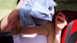 Sexy slim pornstar flashing her small titties outdoors