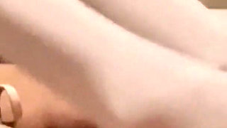 MILF in Pantyhose and Heels Gives a Footjob