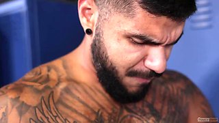 Tattooed Latino having fun with a shy pale lad