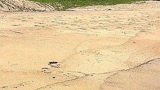 Teasing in Red Bikini on the Beach