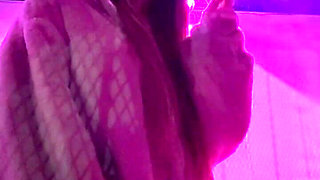 Smoking a Cigarette Outdoor While Wearing Only a Bikini and a Jacket